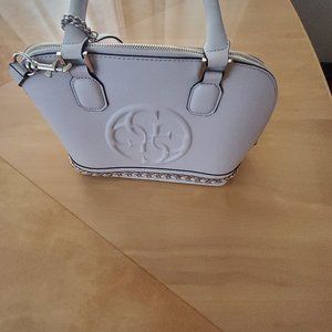 Mauve purse. 3 handles, silver accents